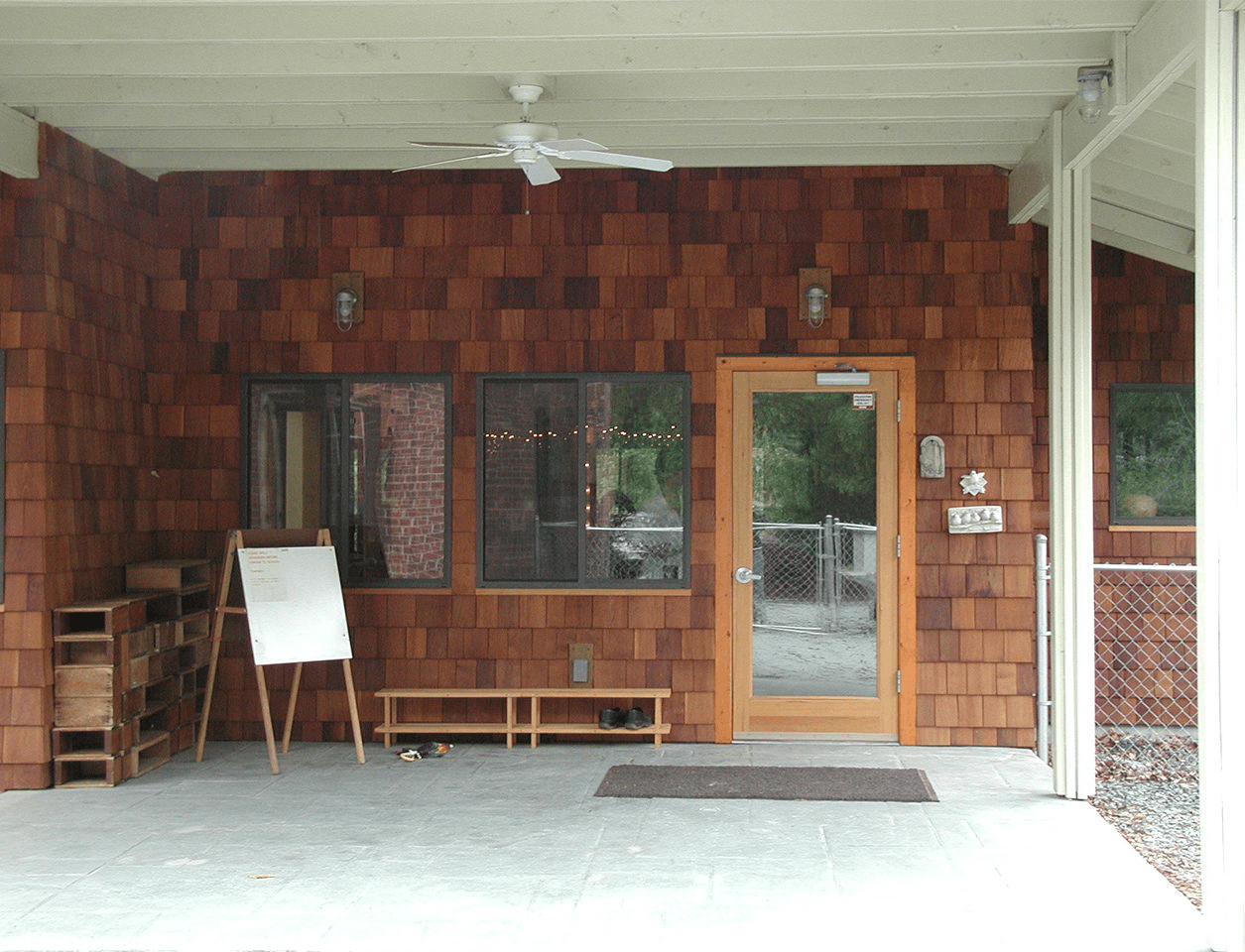 a room with a brick wall and a wooden door